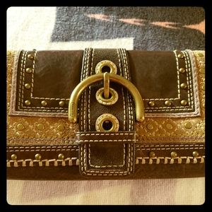 COCoach wallet in leather and bronze